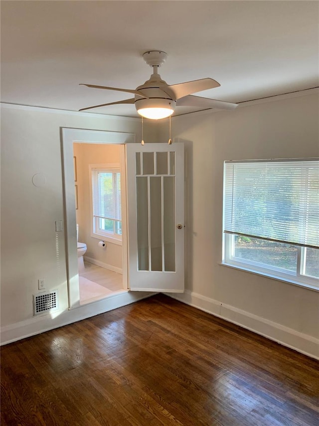 spare room with hardwood / wood-style flooring and ceiling fan