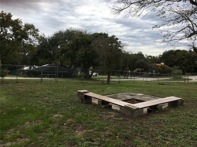 view of property's community with a yard