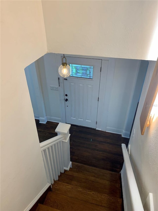 entryway featuring dark wood-type flooring