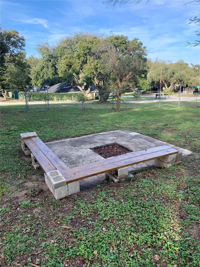 view of storm shelter featuring a lawn