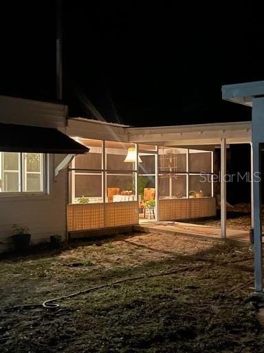 exterior space featuring a sunroom