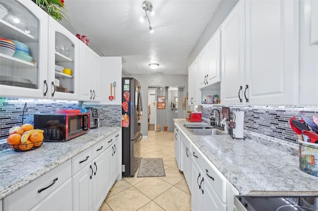 kitchen with backsplash and white cabinets