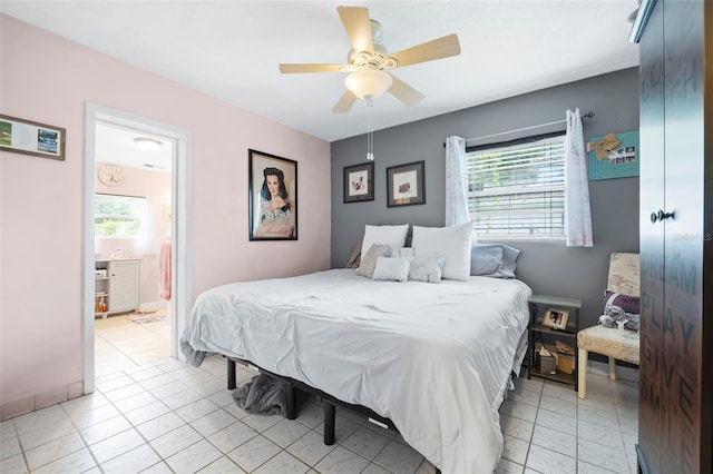 bedroom with ceiling fan and light tile floors