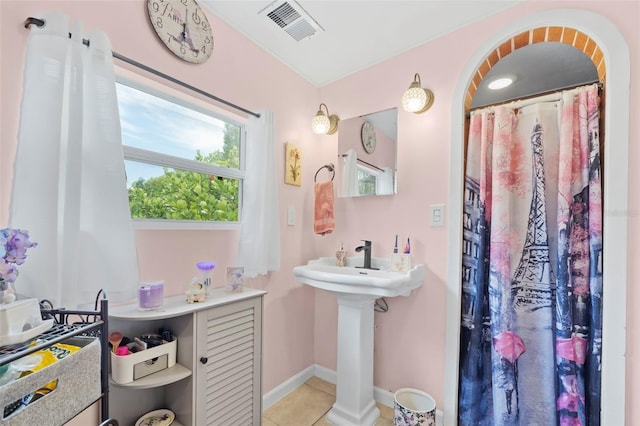 bathroom featuring tile flooring