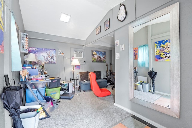 game room featuring vaulted ceiling and a wall unit AC