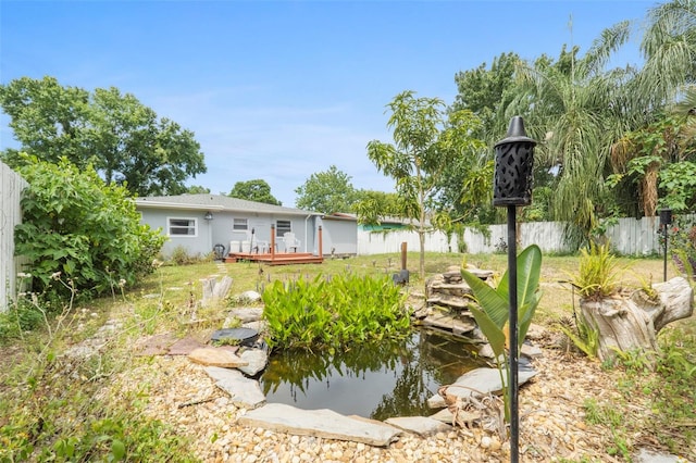 view of yard with a wooden deck