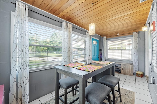 dining room featuring wooden ceiling and light tile flooring