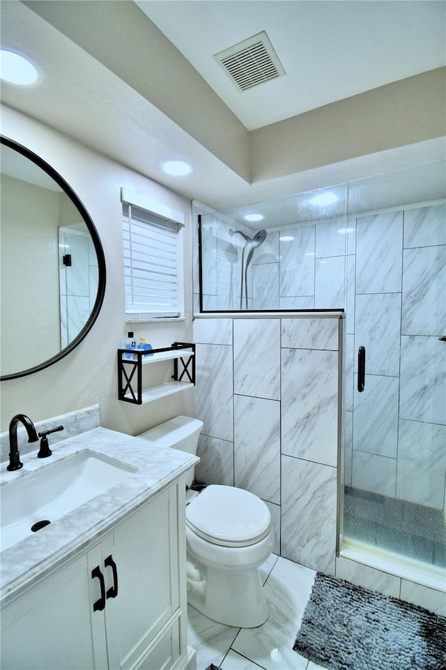 bathroom with toilet, vanity, walk in shower, tile walls, and tile floors