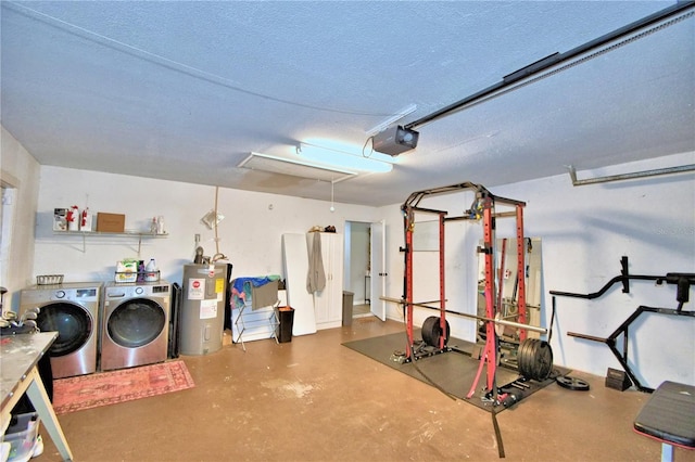 workout area with a textured ceiling, water heater, and washer and clothes dryer
