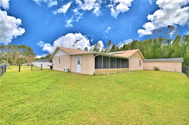 back of house featuring a yard