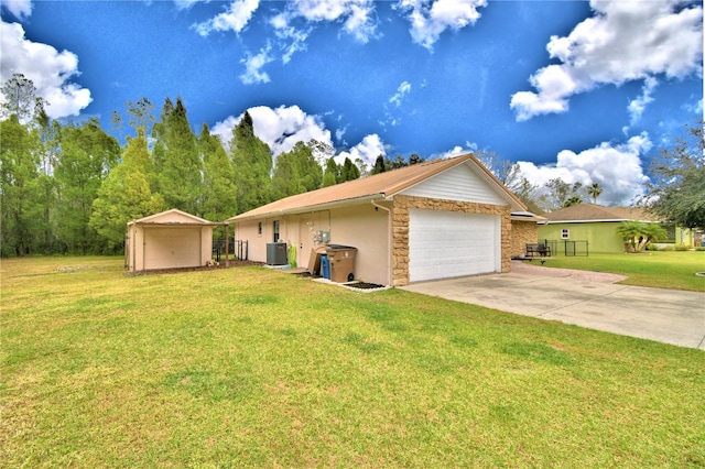 ranch-style house with central AC, a front yard, and a garage
