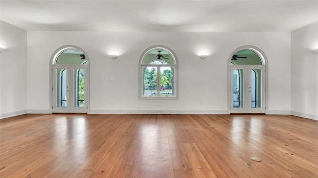 2300 N Scenic Hwy Unit 111, Lake Wales, FL 33898 - unfurnished living room with a ceiling fan and light wood-style floors