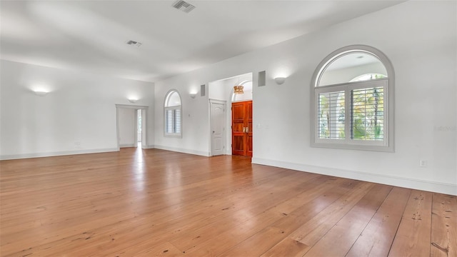 2300 N Scenic Hwy Unit 111, Lake Wales, FL 33898 - unfurnished living room with light wood-style flooring and baseboards