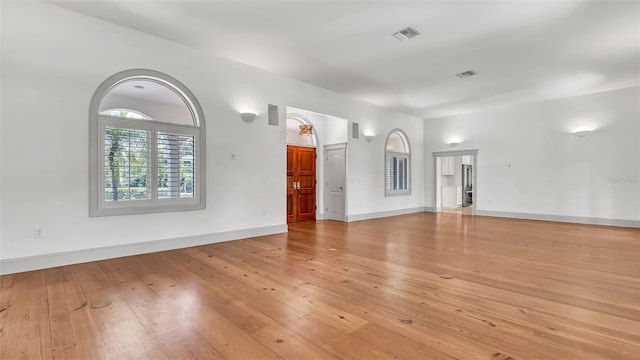 2300 N Scenic Hwy Unit 111, Lake Wales, FL 33898 - unfurnished living room with light wood-style floors and baseboards