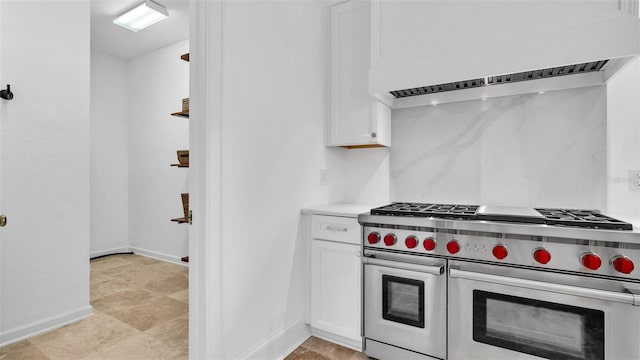 2300 N Scenic Hwy Unit 111, Lake Wales, FL 33898 - kitchen with double oven range, white cabinetry, light countertops, and custom range hood