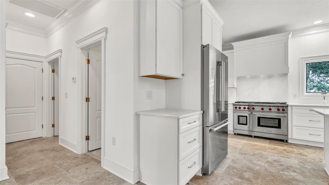 2300 N Scenic Hwy Unit 111, Lake Wales, FL 33898 - kitchen with premium appliances, crown molding, light countertops, white cabinets, and light stone finish flooring