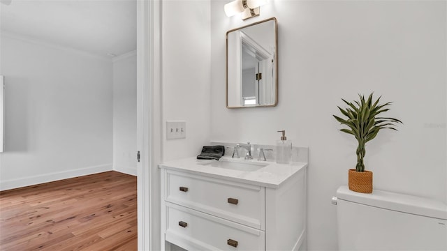 2300 N Scenic Hwy Unit 111, Lake Wales, FL 33898 - half bathroom featuring vanity, wood finished floors, and crown molding