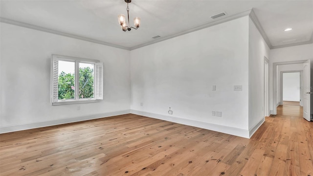 2300 N Scenic Hwy Unit 111, Lake Wales, FL 33898 - empty room with ornamental molding, light wood-type flooring, and a chandelier