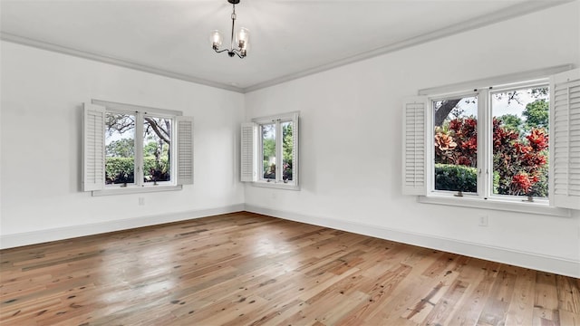 2300 N Scenic Hwy Unit 111, Lake Wales, FL 33898 - empty room with a chandelier, hardwood / wood-style floors, and ornamental molding