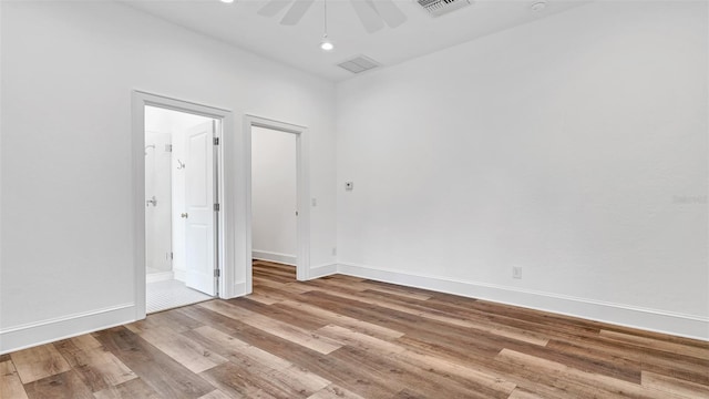 2300 N Scenic Hwy Unit 111, Lake Wales, FL 33898 - empty room with ceiling fan, wood finished floors, and recessed lighting