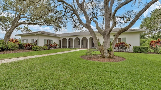 2300 N Scenic Hwy Unit 111, Lake Wales, FL 33898 - ranch-style home featuring stucco siding and a front lawn