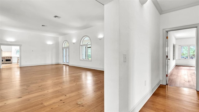 2300 N Scenic Hwy Unit 111, Lake Wales, FL 33898 - unfurnished living room featuring light wood-style flooring and crown molding