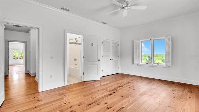 2300 N Scenic Hwy Unit 111, Lake Wales, FL 33898 - unfurnished bedroom with light wood-style flooring, ornamental molding, ensuite bathroom, a ceiling fan, and a closet