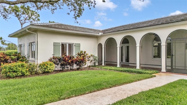 2300 N Scenic Hwy Unit 111, Lake Wales, FL 33898 - back of house with a lawn and stucco siding
