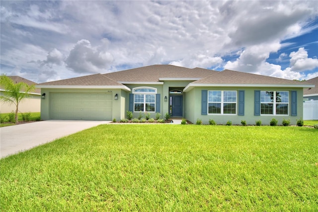 single story home featuring a garage and a front yard