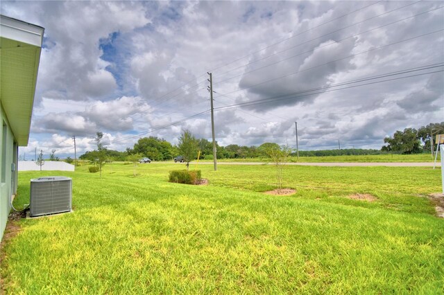 view of yard with central AC