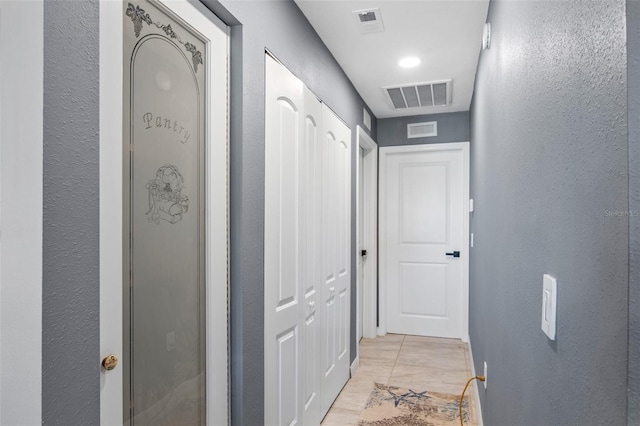 hallway with light tile flooring