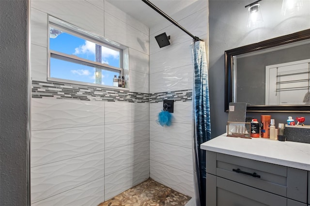 bathroom with vanity and curtained shower