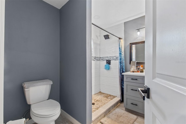 bathroom with vanity, a shower with shower curtain, and toilet