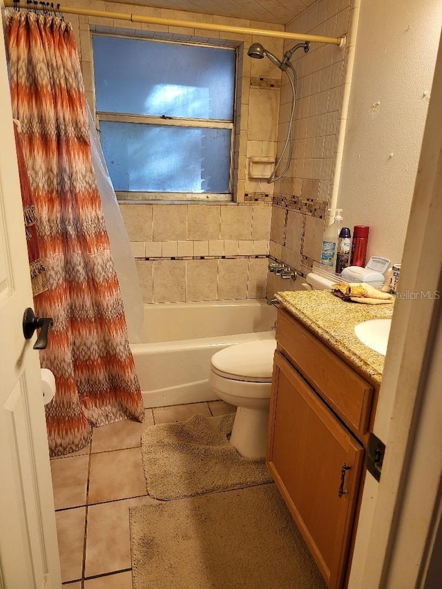 bathroom with tile patterned flooring, vanity, toilet, and shower / bath combo with shower curtain