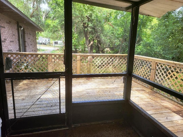 exterior space with a wooded view and a healthy amount of sunlight