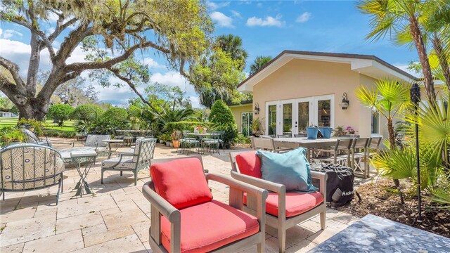 view of patio / terrace featuring french doors and outdoor dining space