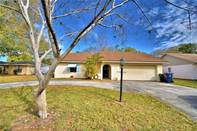 ranch-style house with a front yard and a garage