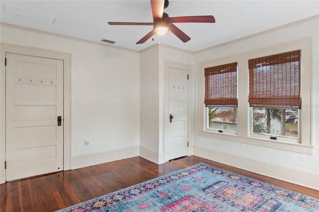 interior space featuring crown molding, dark hardwood / wood-style floors, and ceiling fan