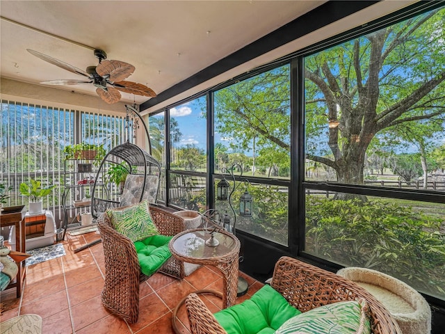 sunroom featuring ceiling fan