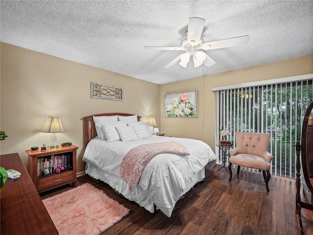 bedroom with a textured ceiling, ceiling fan, and dark hardwood / wood-style floors