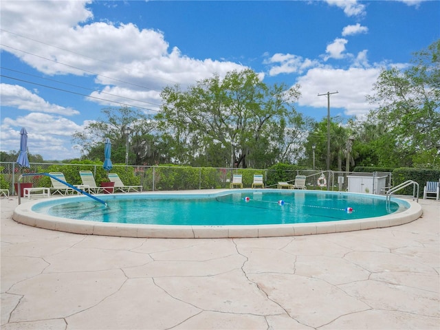 view of swimming pool featuring a patio