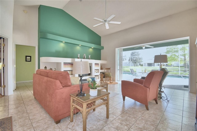 tiled living room with high vaulted ceiling and ceiling fan