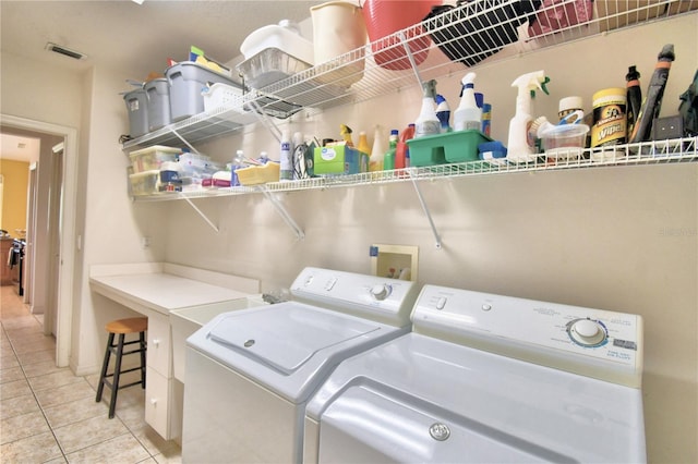 laundry room with light tile flooring, hookup for a washing machine, and independent washer and dryer