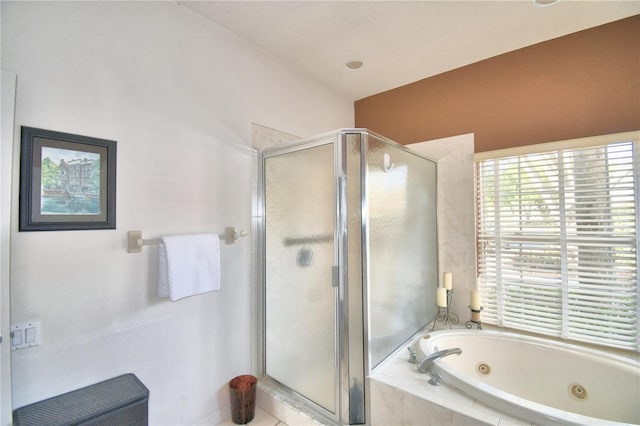 bathroom with shower with separate bathtub