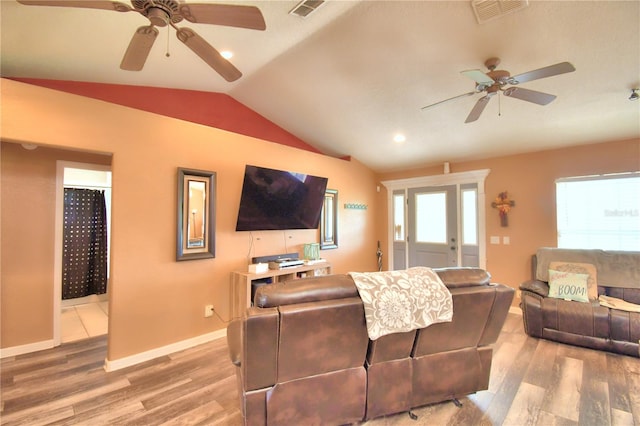 living room featuring vaulted ceiling, hardwood / wood-style floors, and ceiling fan