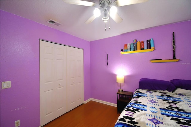 bedroom featuring a closet, ceiling fan, and dark wood-type flooring