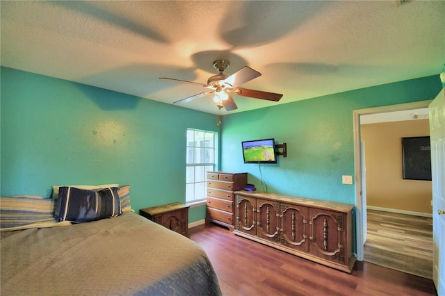 bedroom featuring a textured ceiling, ceiling fan, and hardwood / wood-style flooring