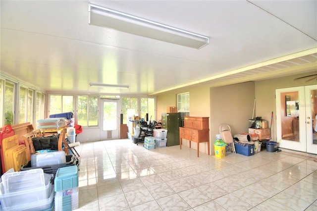 misc room with french doors and light tile patterned floors