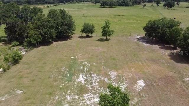 birds eye view of property featuring a rural view