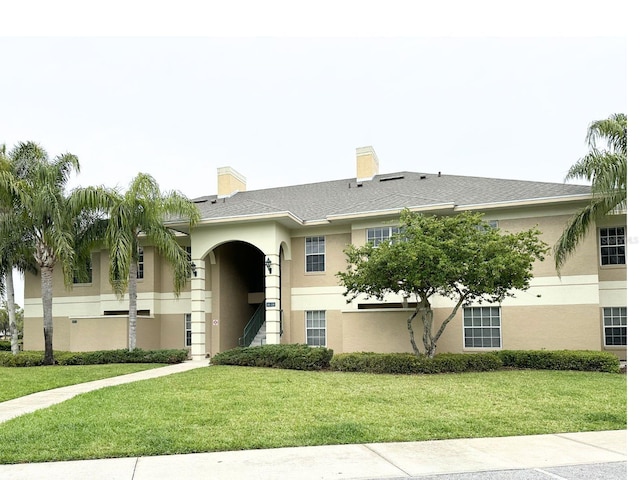 view of front of home with a front yard